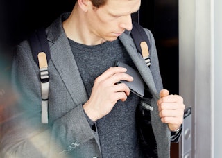 Compact leather wallet with card slots and slim profile, perfect for the jacket pocket