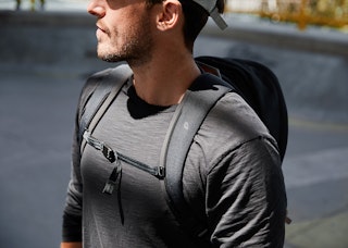 The backpack includes contoured straps and lumbar support for comfort and stability